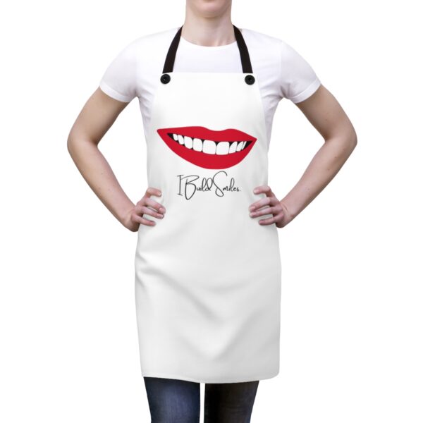 Person wearing apron with big smile, captioned, "I Build Smiles."